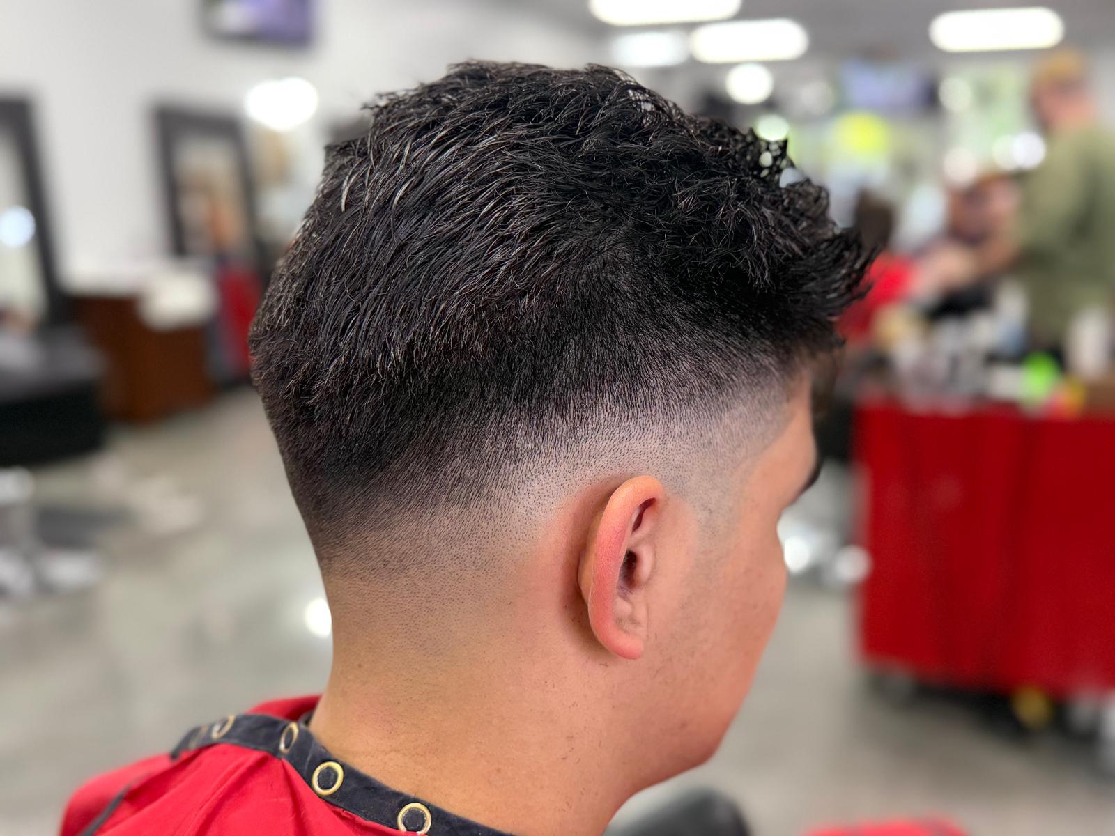 Fresh low fade with textured styling