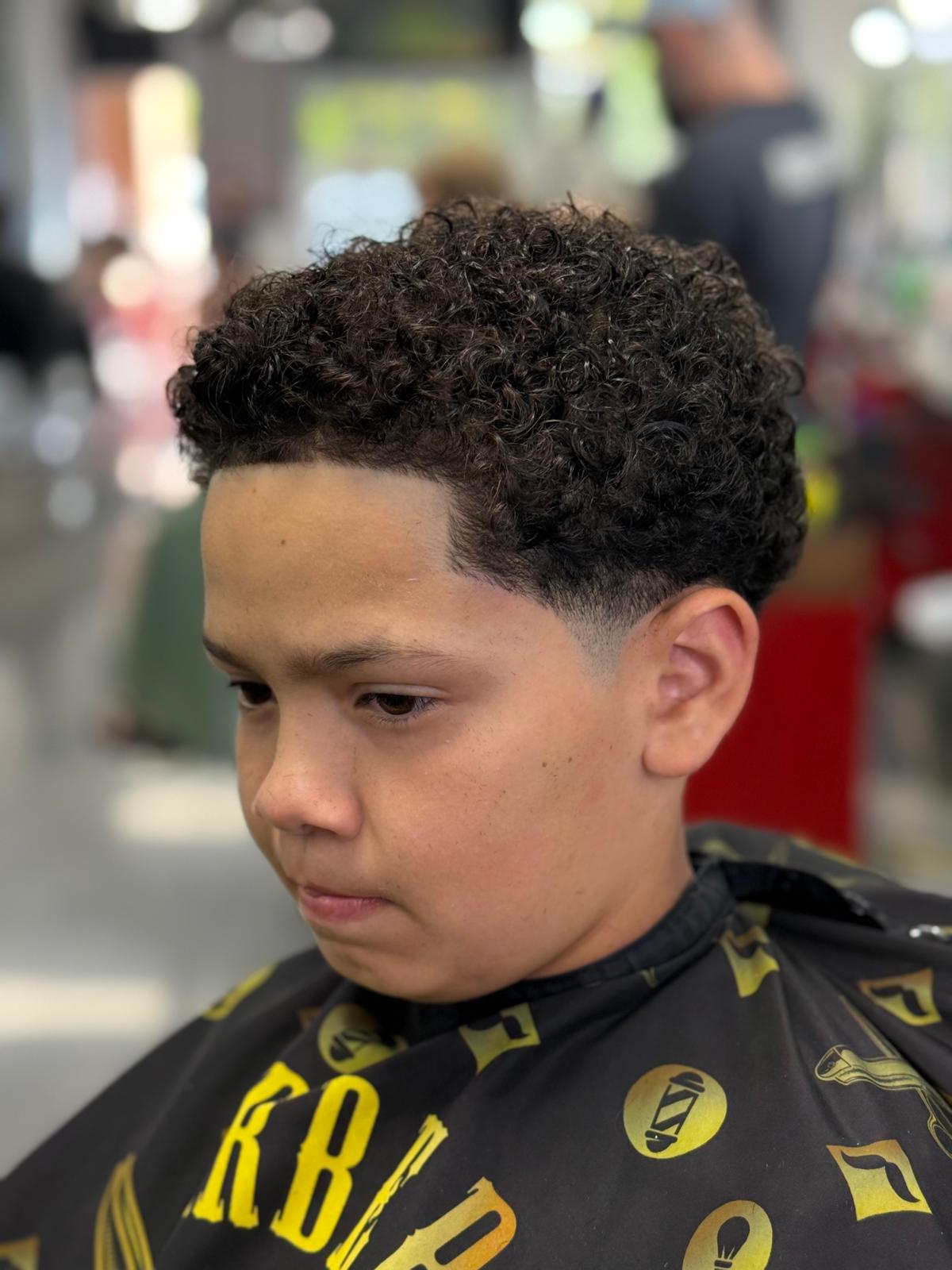 Rigby’s barber shaping a client’s haircut